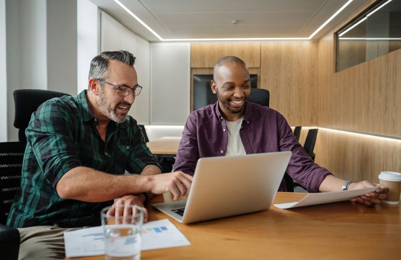 Sharp Hue team collaborating on a strategic web development project for a business client.